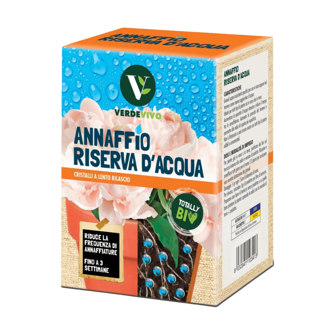 Confezione di cristalli a lento rilascio Verdevivo Annaffio Riserva d’Acqua, caratterizzata da un design con fiori rosa e gocce d’acqua su sfondo azzurro. Prodotto bio che riduce la frequenza di annaffiature fino a 3 settimane, indicato per mantenere il terreno idratato.