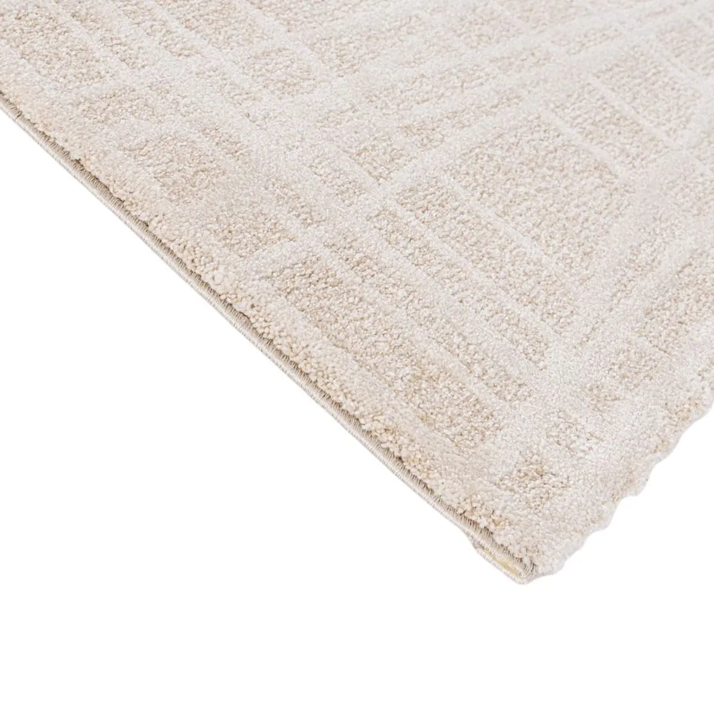 Primo piano sul bordo del tappeto Tania beige cream con texture tono su tono