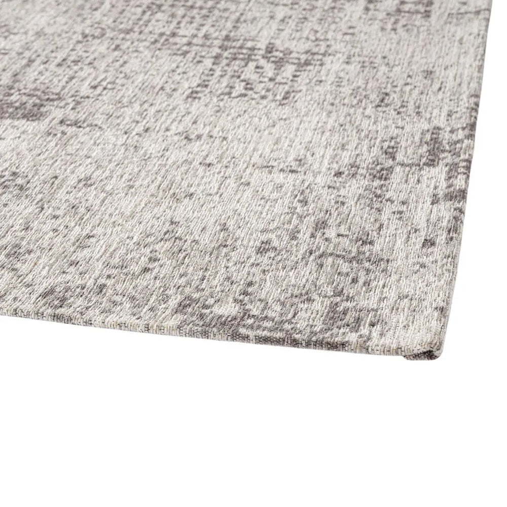 Primo piano del bordo del tappeto Suri grigio effetto mélange, stile minimal