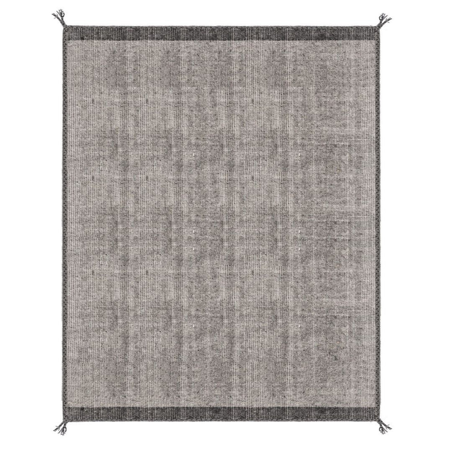 Tappeto Chathu grigio sotto tavolo da pranzo in ambiente luminoso

