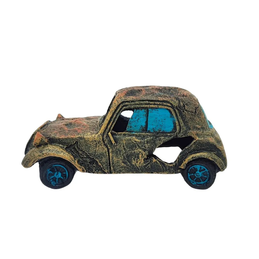 Auto in resina vista laterale, design retrò con dettagli blu e finitura anticata, perfetta per scenografie verdi e miniature creative