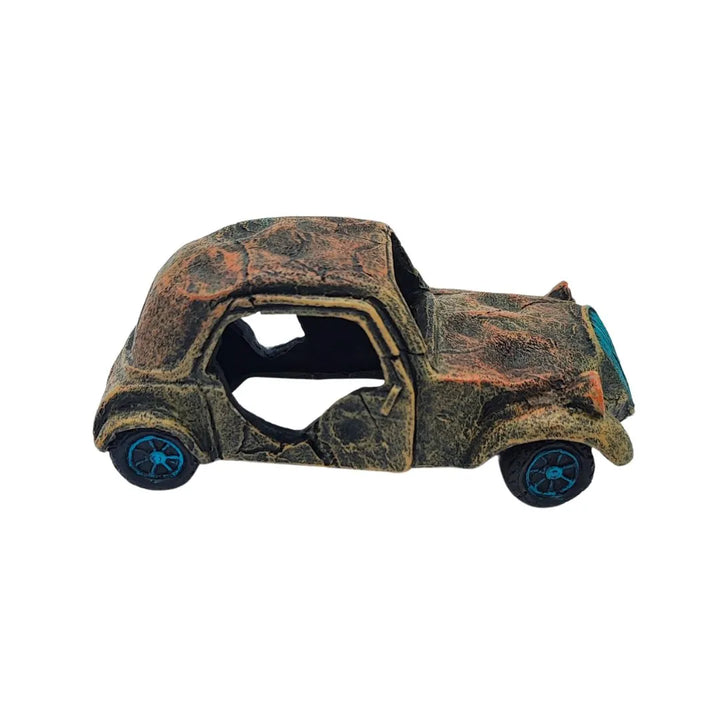 Vista laterale opposta dell’auto decorativa in resina, con finestrini aperti e ruote scolpite, complemento originale per paesaggi in miniatura
