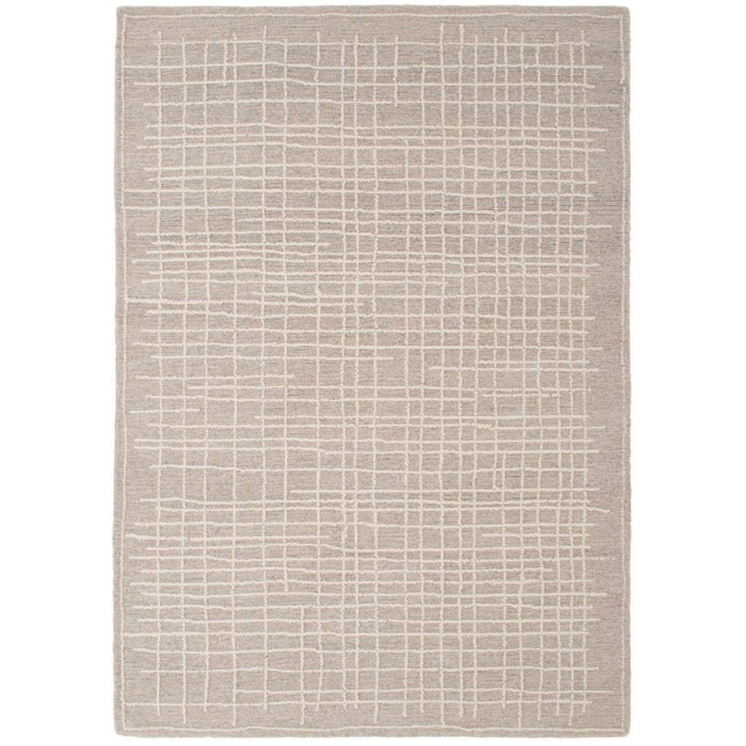 Tappeto moderno grigio chiaro con motivo geometrico a griglia in rilievo – vista dall'alto