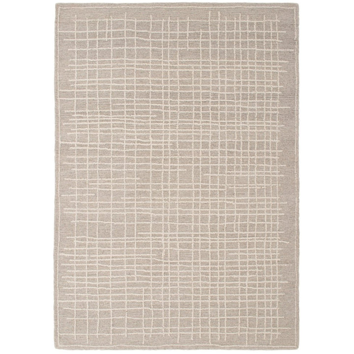 Tappeto moderno grigio chiaro con motivo geometrico a griglia in rilievo – vista dall'alto