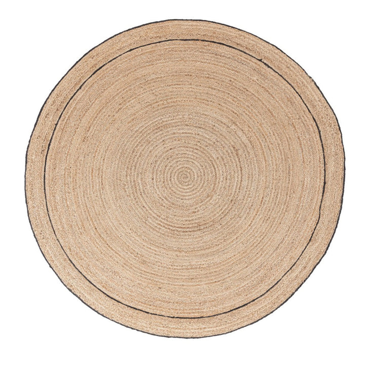 Tappeto rotondo in juta naturale con doppio bordo nero decorativo, ideale per ambienti eco-friendly e dal design minimale.