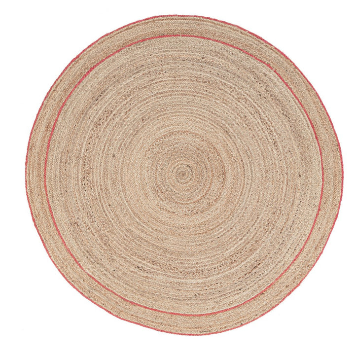 Tappeto rotondo in juta con bordatura rossa, stile naturale e finitura rustica ideale per ambienti moderni.