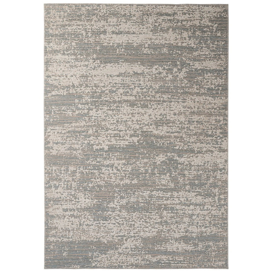 Tappeto moderno rettangolare con sfumature irregolari nei toni del beige e del blu, dal look astratto e testurizzato.

