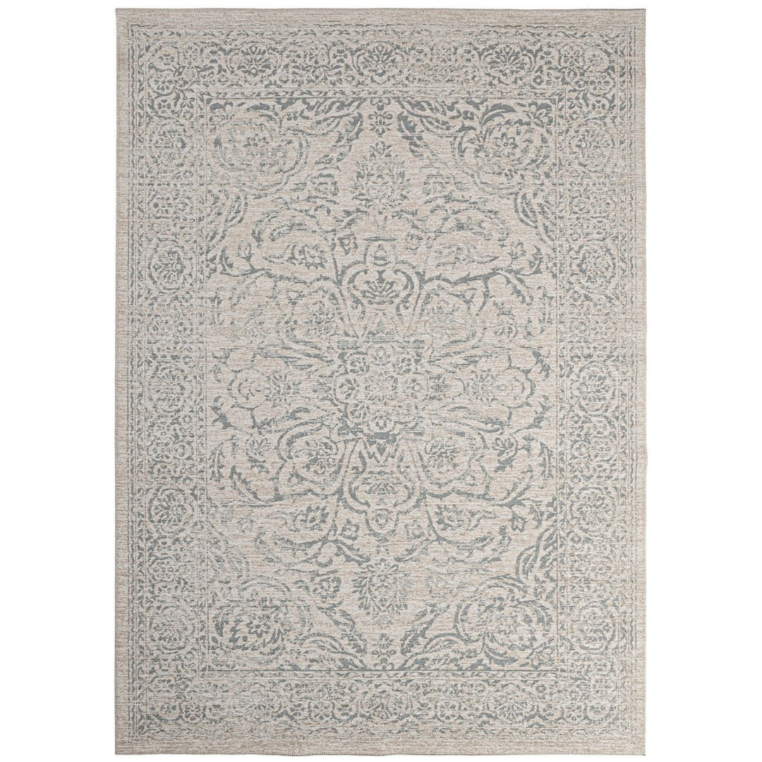 Tappeto stile orientale beige con dettagli floreali in rilievo, effetto vintage e finitura elegante.
