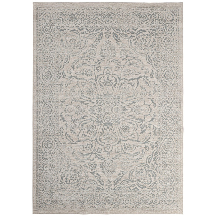 Tappeto stile orientale beige con dettagli floreali in rilievo, effetto vintage e finitura elegante.