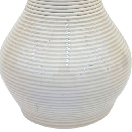 Vaso artigianale in argilla naturale per piante da interno in idrocultura – superficie rigata e forma a goccia